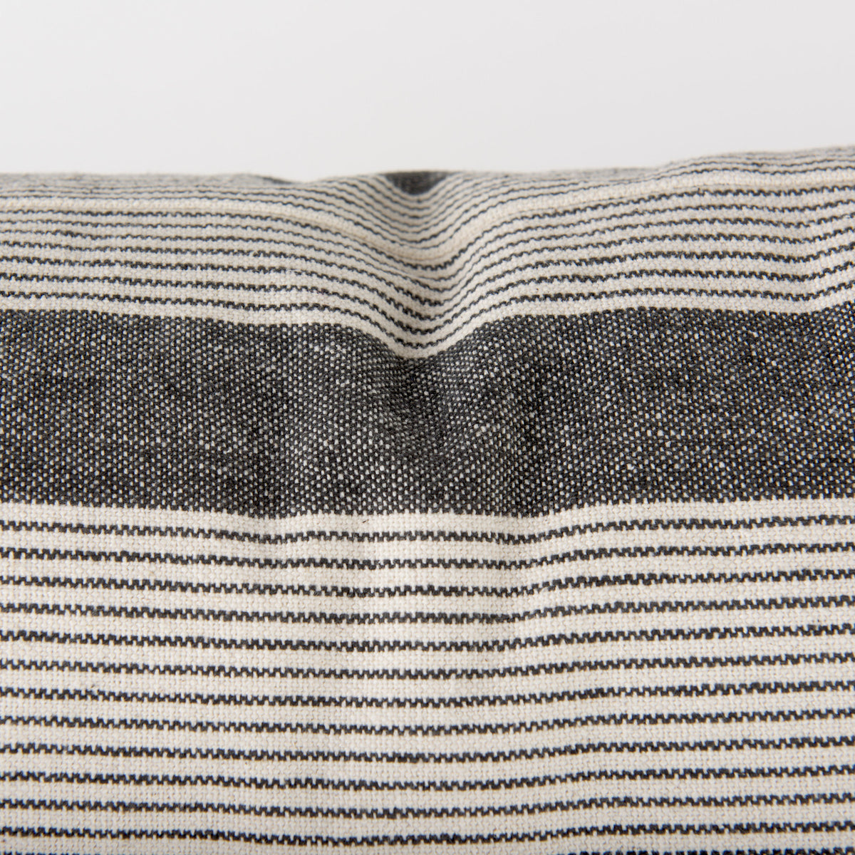 detailed view of grey and beige stripes on Nancy accent pillow