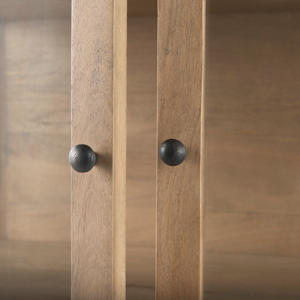 black metal door knobs on the Arelius display cabinet 